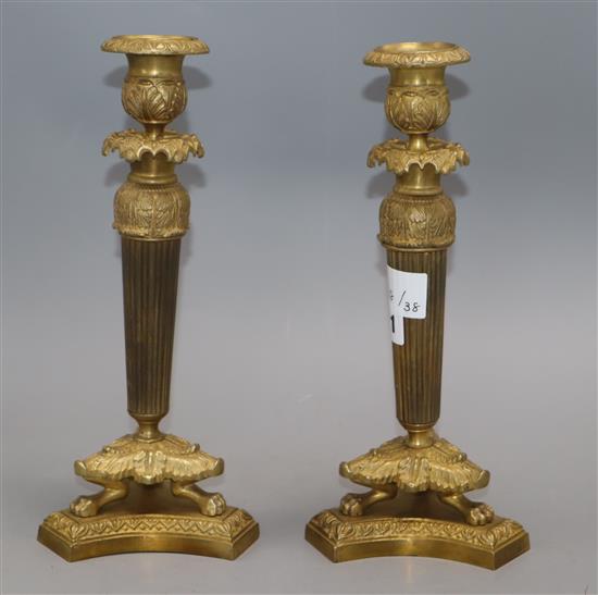 A pair of ormolu Empire style candlesticks height 27cm